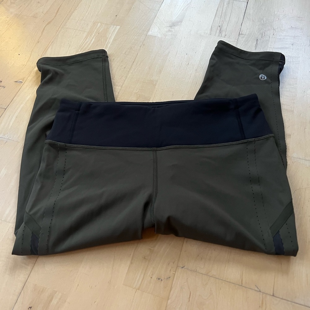 Lululemon olive cropped leggings with adorable mesh detail on sides.